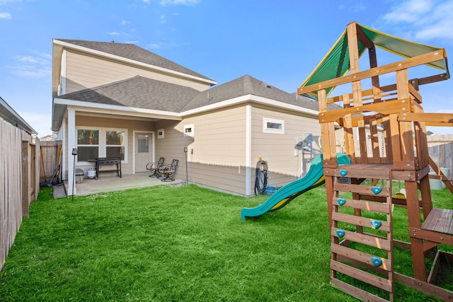 exterior space with a yard, a playground, and a patio area