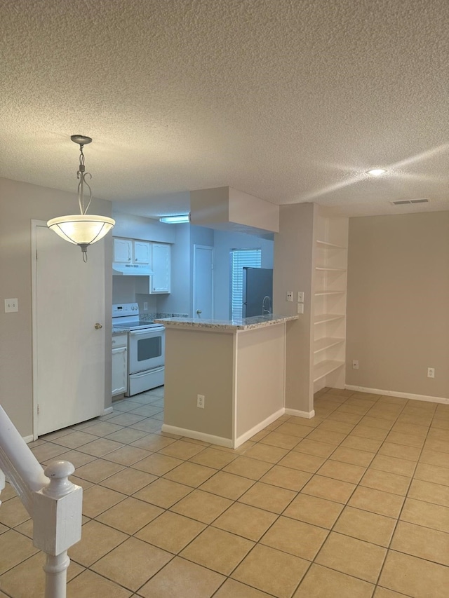 kitchen with white cabinets, hanging light fixtures, fridge, white electric range oven, and kitchen peninsula