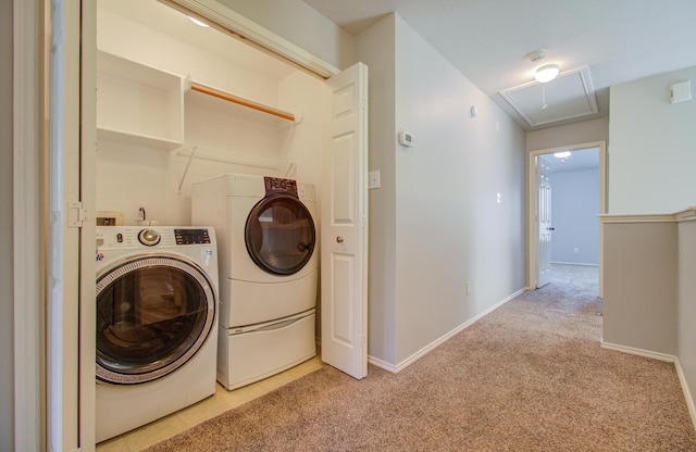 washroom featuring light carpet and washing machine and clothes dryer