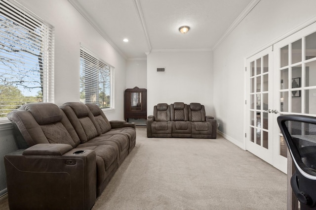 living room with carpet floors, ornamental molding, and french doors