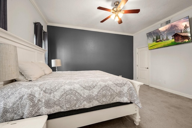 bedroom featuring ceiling fan, carpet floors, and crown molding