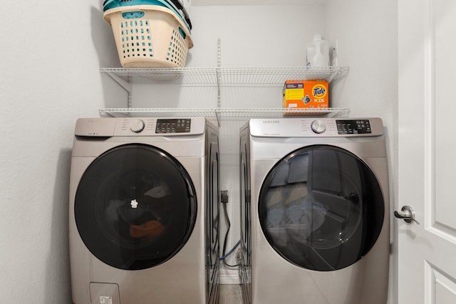 washroom featuring separate washer and dryer