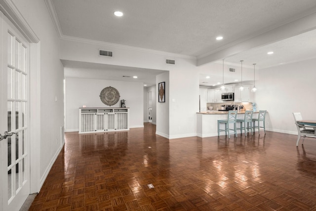 living room featuring crown molding, dark parquet floors, and a textured ceiling