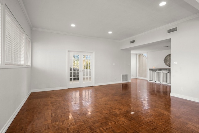 unfurnished room with dark parquet floors, ornamental molding, and french doors