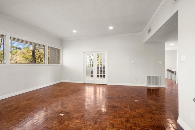 empty room featuring french doors, crown molding, dark parquet floors, and a textured ceiling