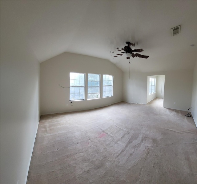 additional living space featuring ceiling fan, lofted ceiling, and light carpet