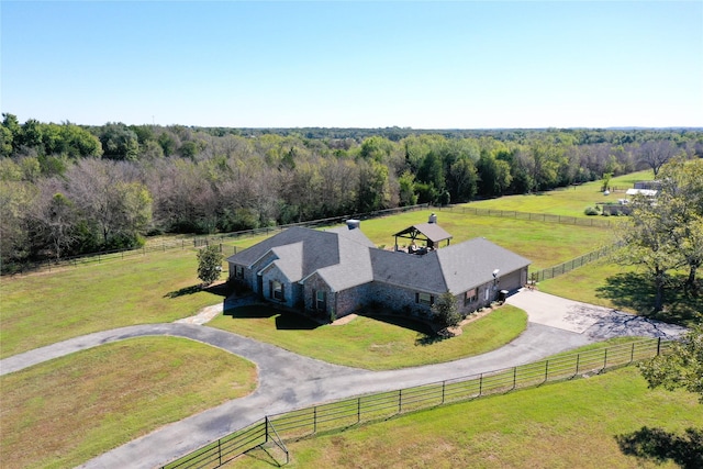 birds eye view of property with a rural view