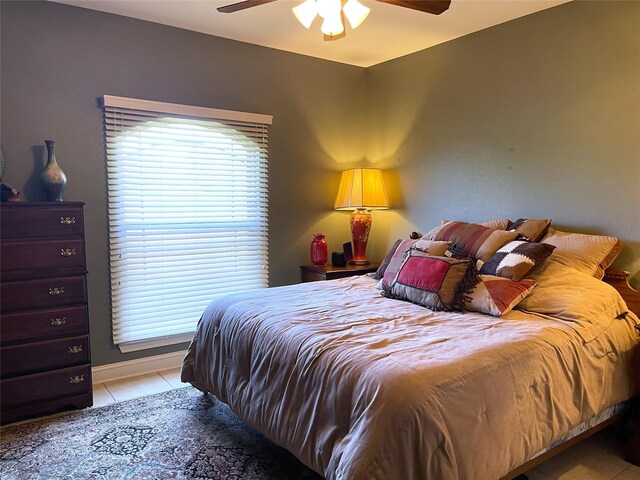 bedroom featuring ceiling fan and light tile patterned floors