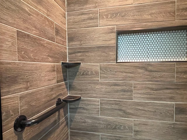 room details with a tile shower