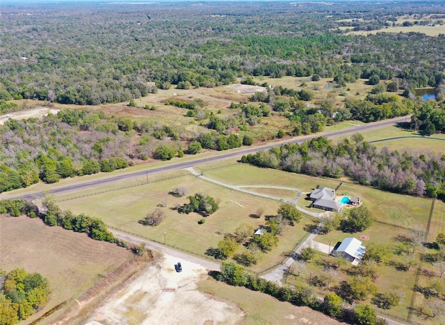 birds eye view of property with a rural view