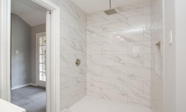 bathroom featuring tiled shower