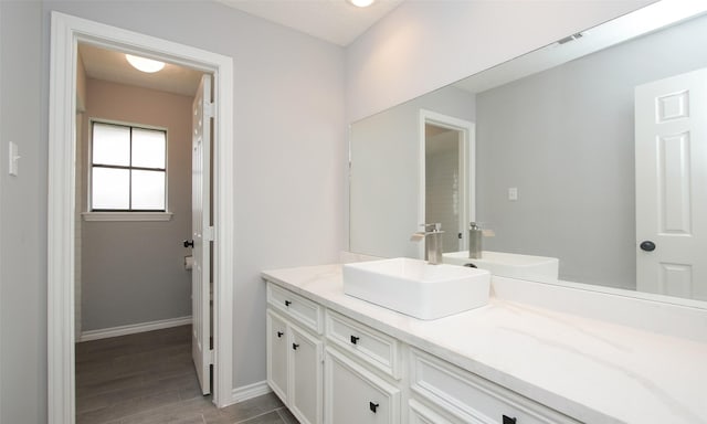 bathroom with vanity and wood-type flooring