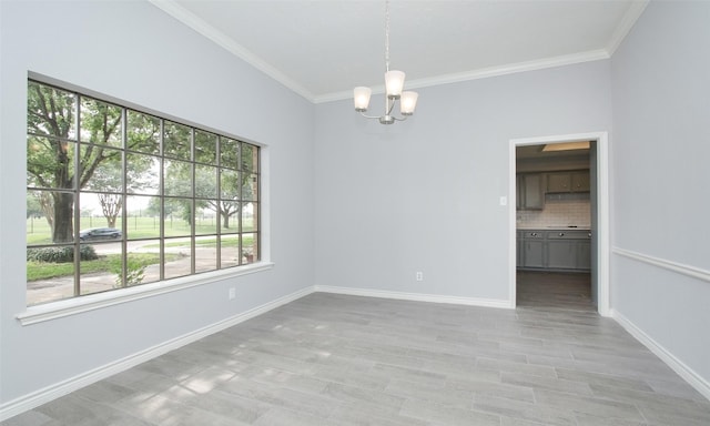 unfurnished room with a chandelier and ornamental molding