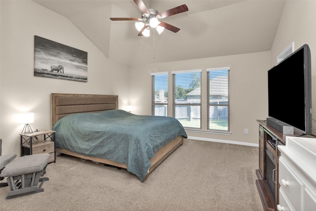 carpeted bedroom featuring ceiling fan and vaulted ceiling