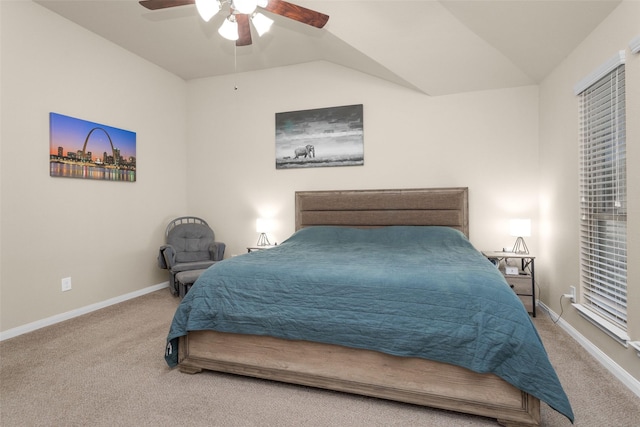 bedroom with ceiling fan, carpet floors, and vaulted ceiling