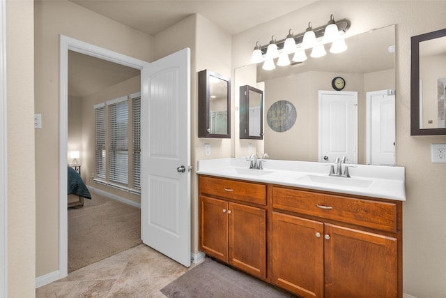 bathroom featuring tile patterned flooring and vanity