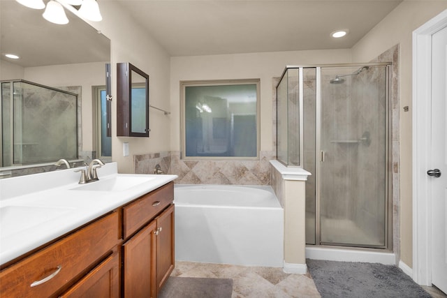 bathroom featuring tile patterned floors, vanity, and separate shower and tub