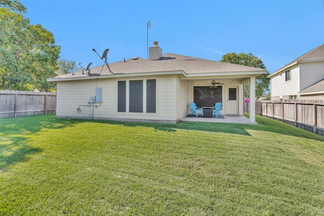 back of house with a lawn, ceiling fan, and a patio area