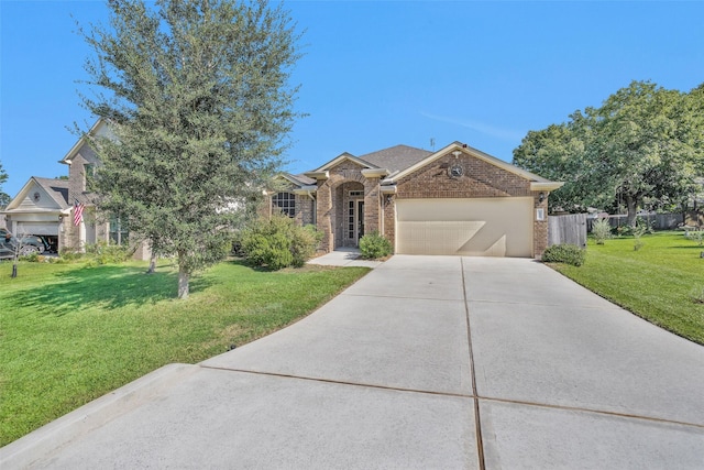 view of front facade with a front yard and a garage