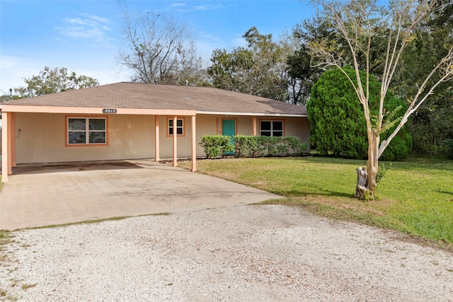 ranch-style home featuring a front yard and a carport