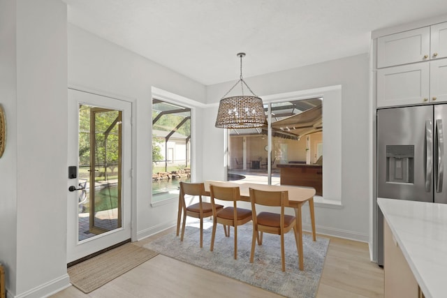 dining area with light hardwood / wood-style floors