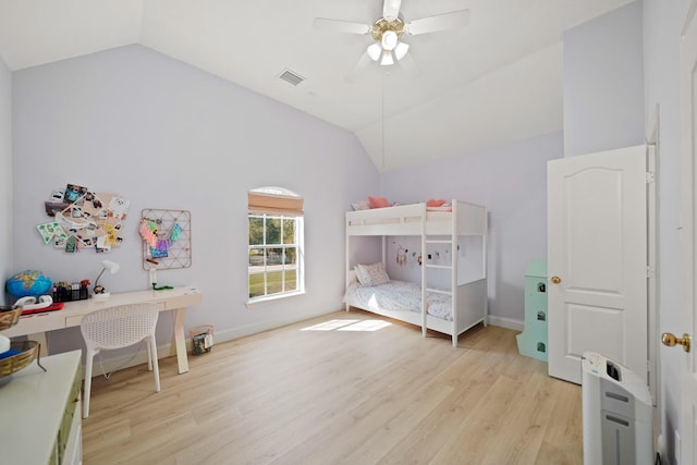 bedroom featuring ceiling fan, lofted ceiling, and light wood-type flooring