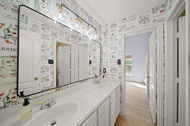 bathroom featuring wood-type flooring and vanity