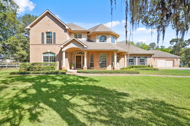 view of front of property featuring a garage and a front yard