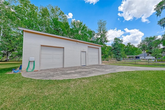 garage featuring a lawn