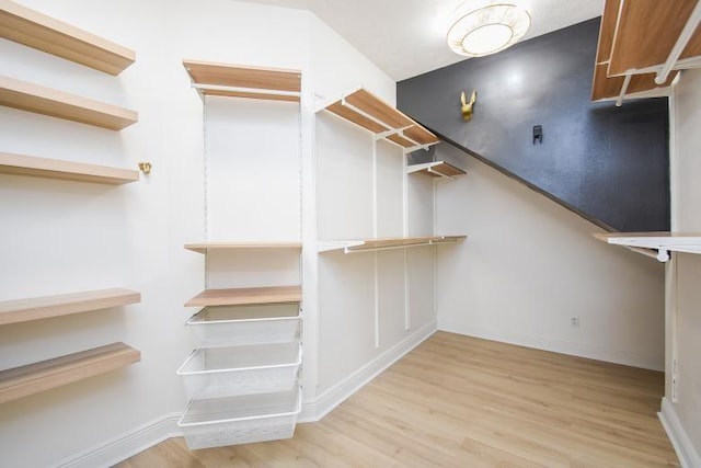 walk in closet featuring light hardwood / wood-style floors