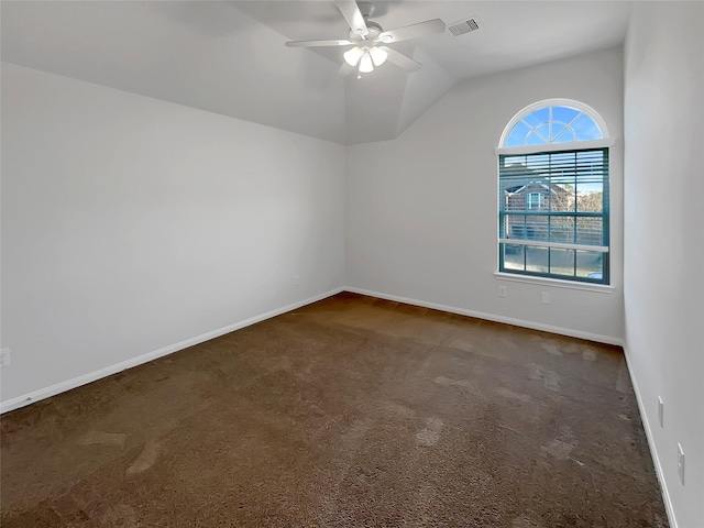 carpeted spare room with ceiling fan and lofted ceiling