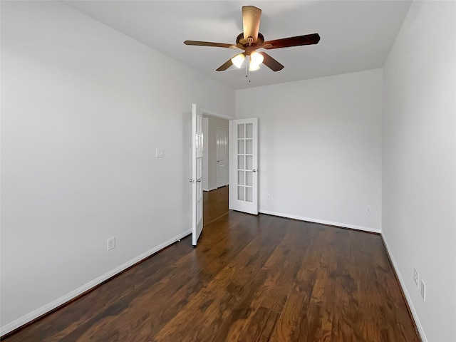 unfurnished room with french doors, dark hardwood / wood-style flooring, and ceiling fan