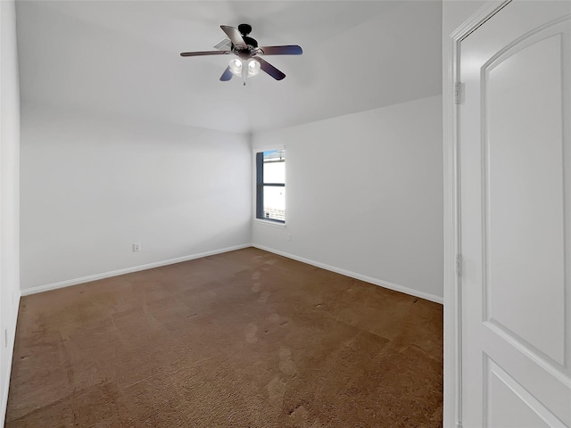 carpeted empty room featuring ceiling fan