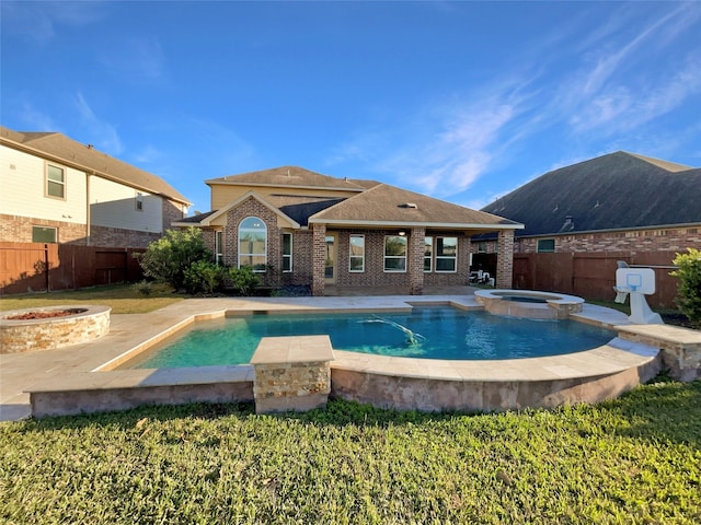 view of pool with an in ground hot tub, a patio, and a fire pit