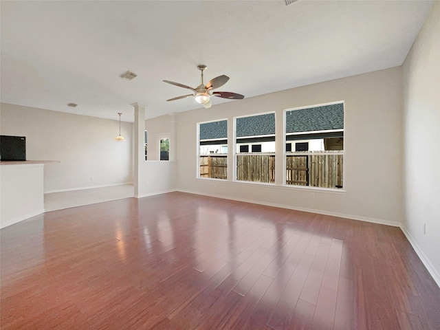 unfurnished living room featuring ceiling fan and wood-type flooring