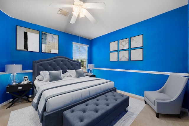 bedroom featuring ceiling fan and light colored carpet