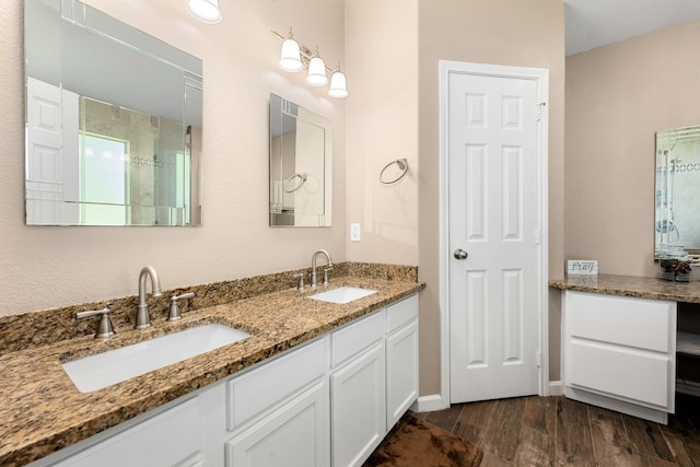 bathroom featuring vanity and hardwood / wood-style flooring