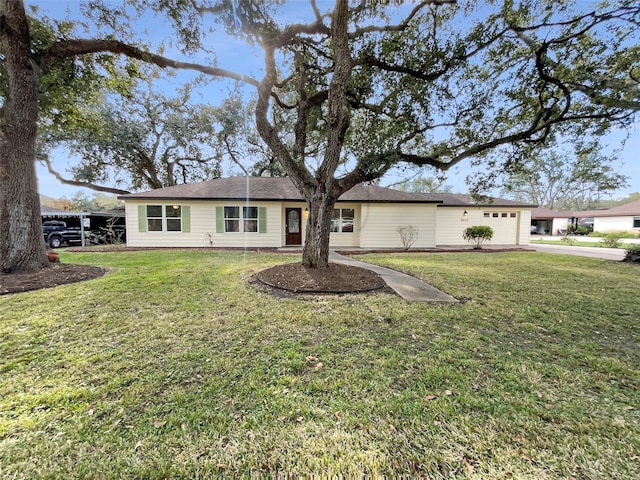 view of front facade with a front yard and a garage