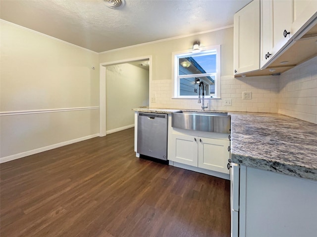 kitchen with dark wood-type flooring, sink, white cabinets, and stainless steel dishwasher