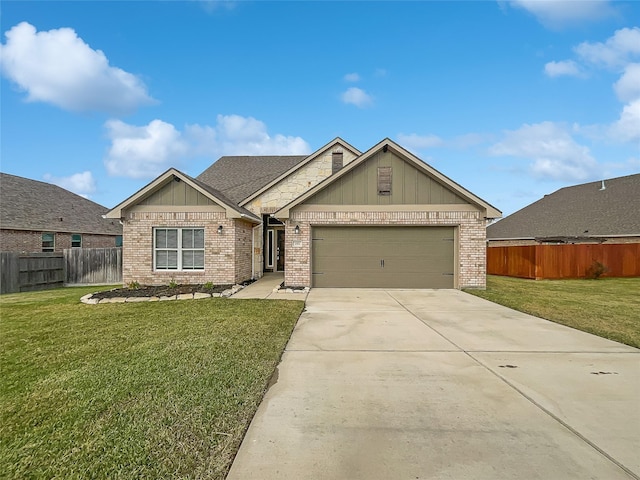 view of front of house featuring a front yard and a garage