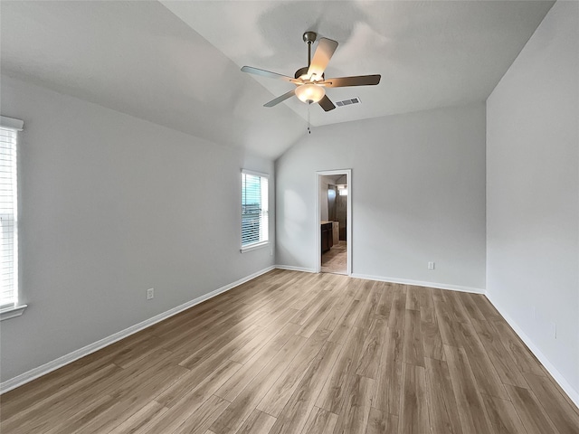 unfurnished room with ceiling fan, light hardwood / wood-style flooring, and vaulted ceiling