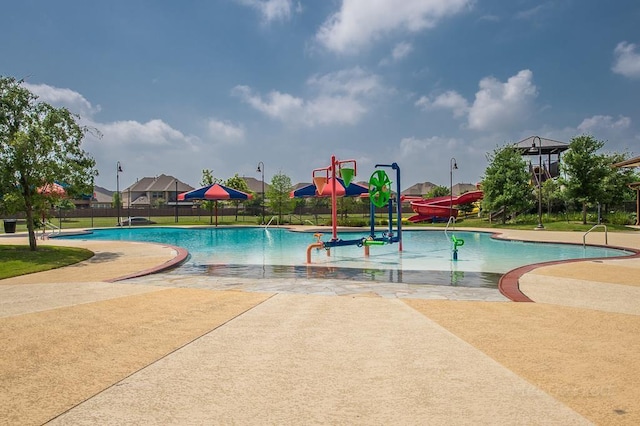 view of pool featuring a water slide