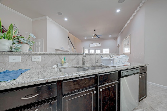 kitchen with dishwasher, light tile patterned floors, ceiling fan, ornamental molding, and sink