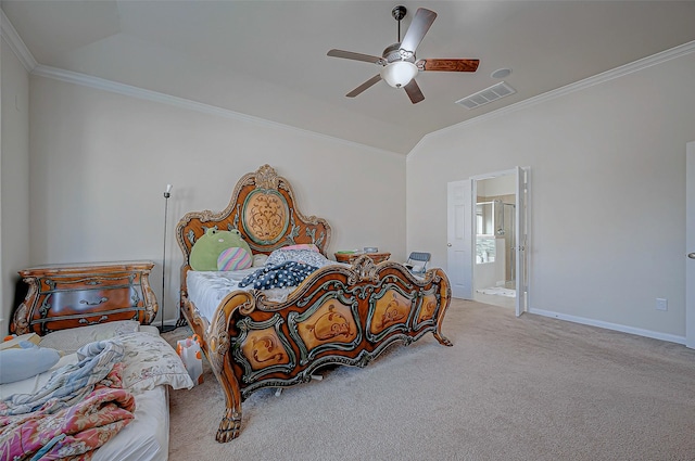 bedroom featuring ensuite bath, lofted ceiling, carpet floors, crown molding, and ceiling fan