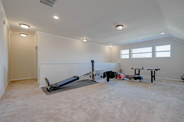 workout room with ornamental molding, vaulted ceiling, and light colored carpet