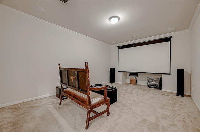 cinema featuring ornamental molding and light colored carpet