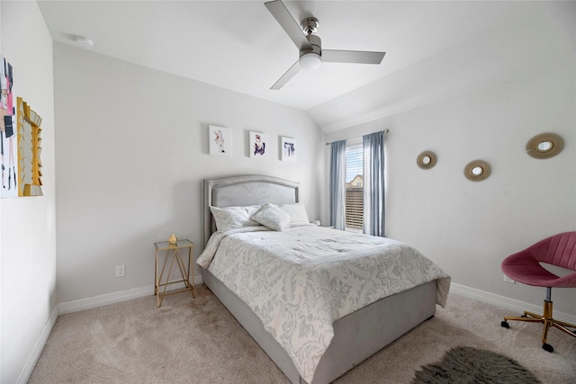 bedroom featuring ceiling fan, light colored carpet, and lofted ceiling