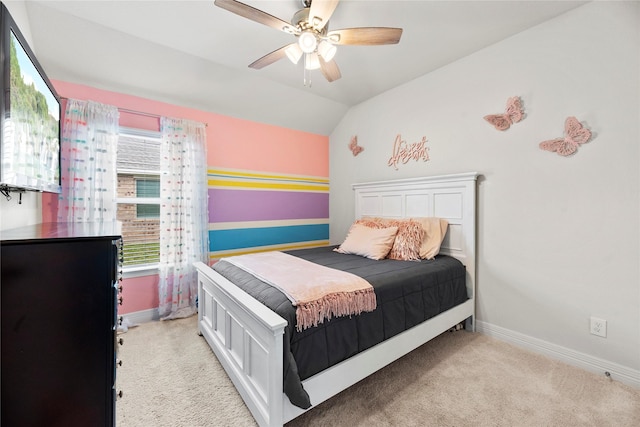 bedroom featuring ceiling fan, light colored carpet, and vaulted ceiling