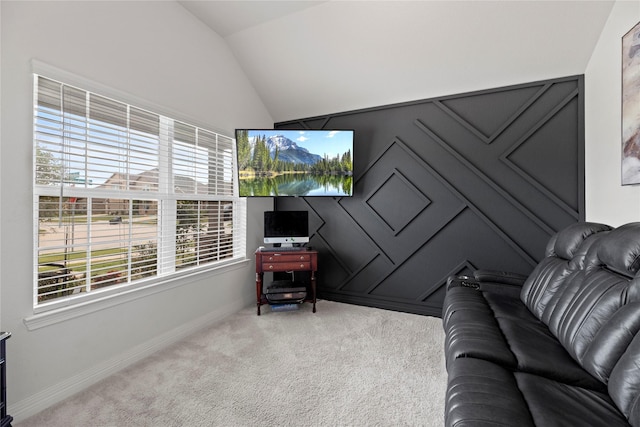 carpeted living room featuring vaulted ceiling