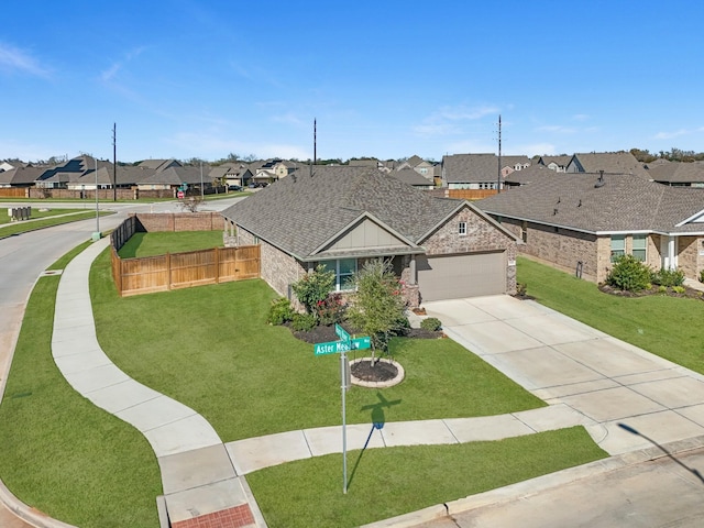 ranch-style house with a garage and a front lawn